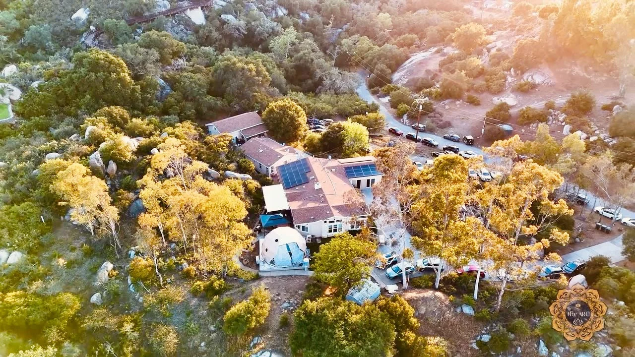Aerial view of The ARC retreat campus surrounded by mountain landscape