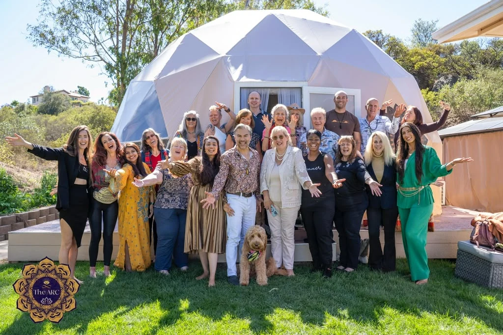 A group gathered outside the geodesic dome at The ARC